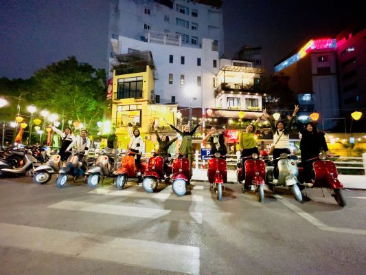 Capture the charm of Hanoi at night from the seat of a Vespa.